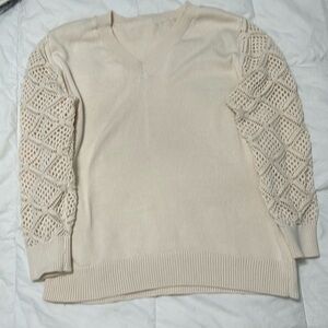 Cream colored 
V neck sweater
Large
New without tags